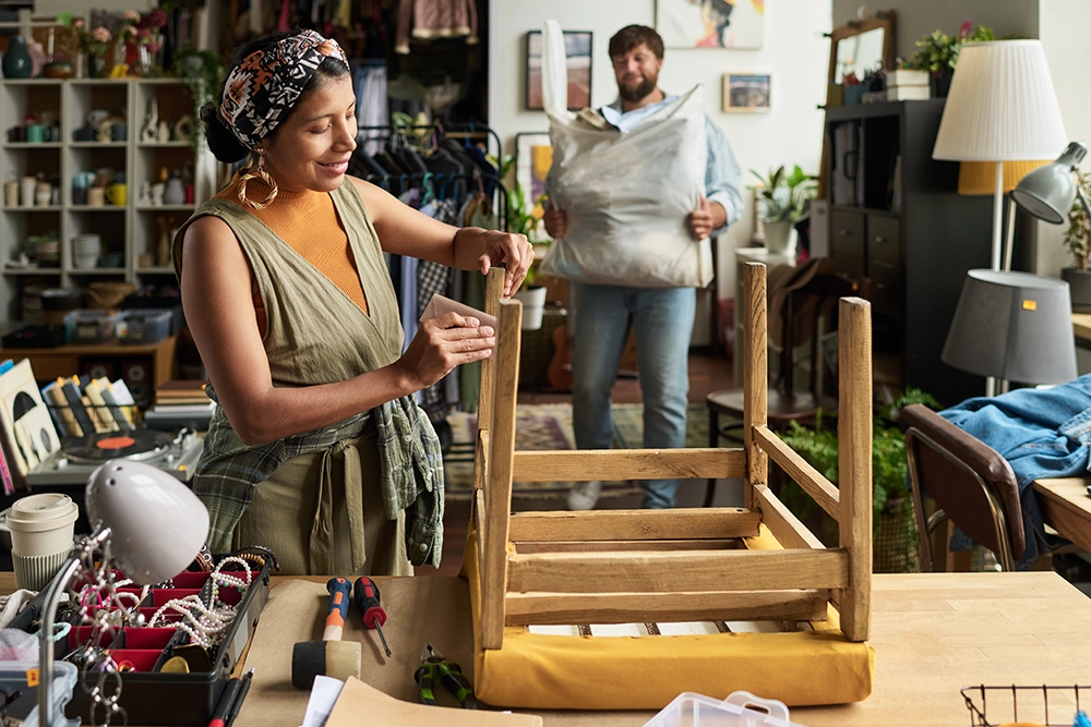 wiping dust from secondhand wooden chair 2025 03 16 16 13 06 utc